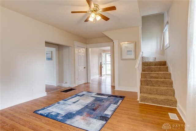 216 S Short St, Troy, OH 45373 - empty room with a ceiling fan, stairs, wood finished floors, and baseboards