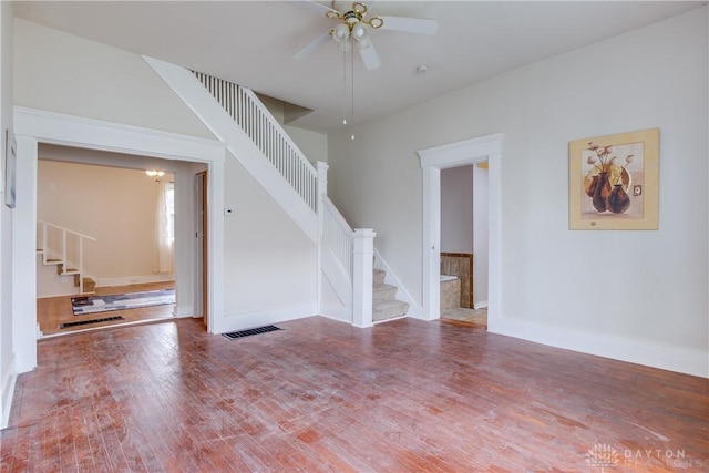 216 S Short St, Troy, OH 45373 - spare room with stairway, ceiling fan, wood finished floors, and baseboards