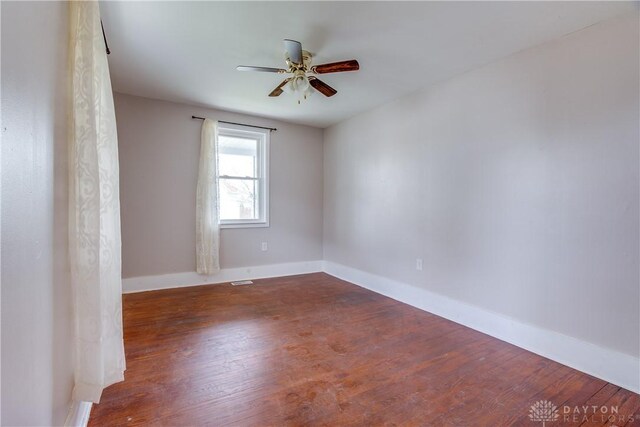 216 S Short St, Troy, OH 45373 - spare room with wood finished floors, a ceiling fan, and baseboards