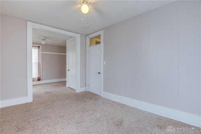 216 S Short St, Troy, OH 45373 - unfurnished room with carpet floors, a ceiling fan, and baseboards
