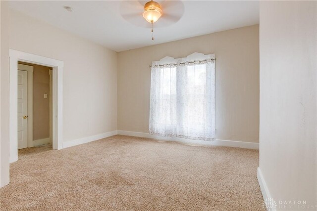 216 S Short St, Troy, OH 45373 - carpeted spare room with baseboards and ceiling fan