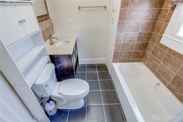 216 S Short St, Troy, OH 45373 - bathroom featuring tile patterned floors, toilet, vanity, and baseboards