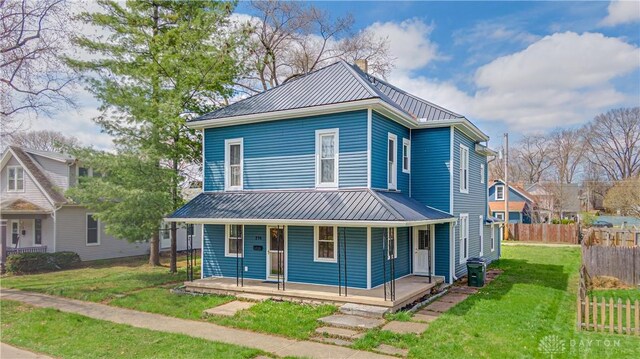 216 S Short St, Troy, OH 45373 - view of front facade featuring metal roof, covered porch, and a chimney