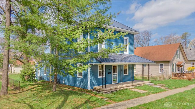 216 S Short St, Troy, OH 45373 - view of front of property featuring a porch, a front yard, and metal roof