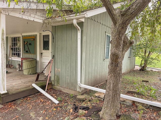 view of home's exterior featuring a wooden deck