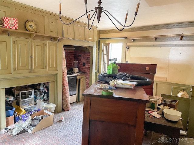 kitchen featuring a center island, cream cabinetry, and electric stove