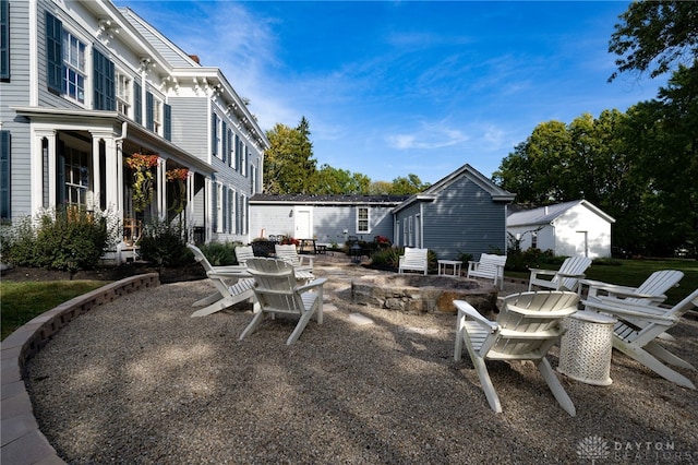 view of patio / terrace featuring an outdoor fire pit