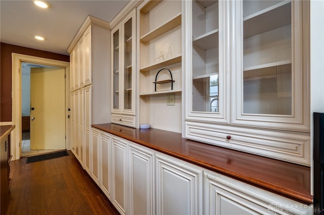 kitchen with dark hardwood / wood-style flooring