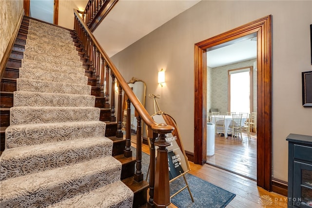 stairway featuring wood-type flooring