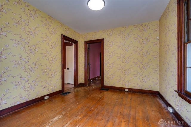 unfurnished room featuring hardwood / wood-style floors