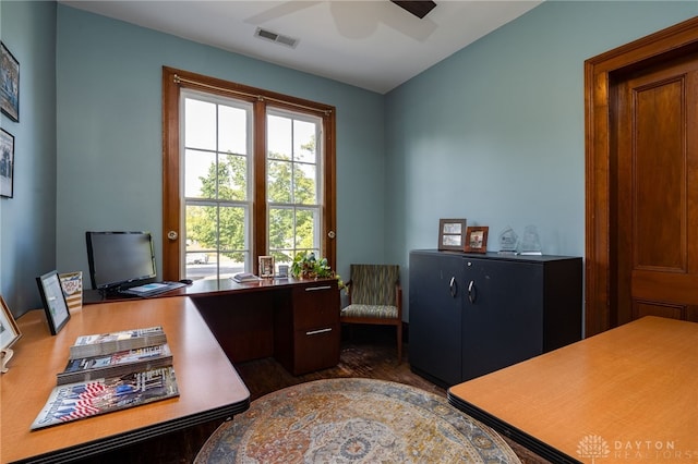 office with ceiling fan and dark hardwood / wood-style flooring