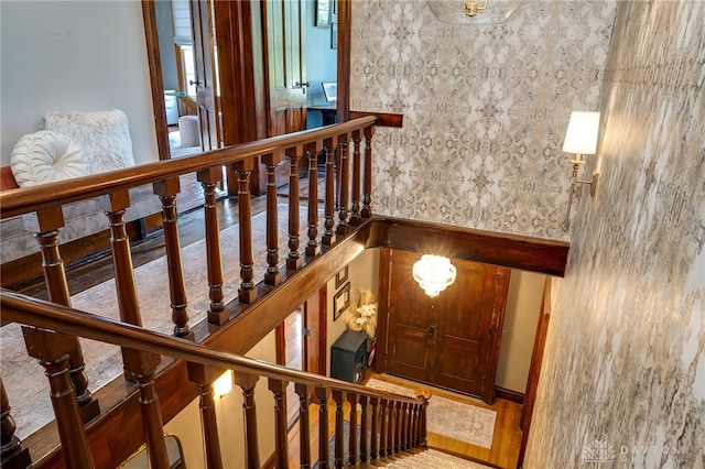 stairway featuring hardwood / wood-style flooring