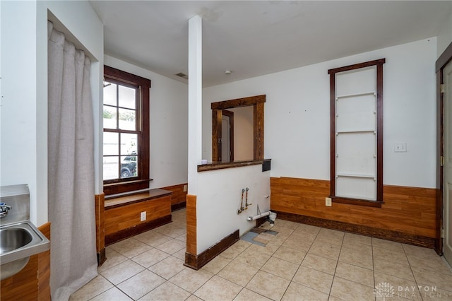 interior space featuring sink and light tile patterned floors