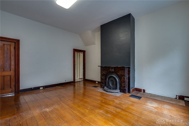 unfurnished living room with hardwood / wood-style flooring