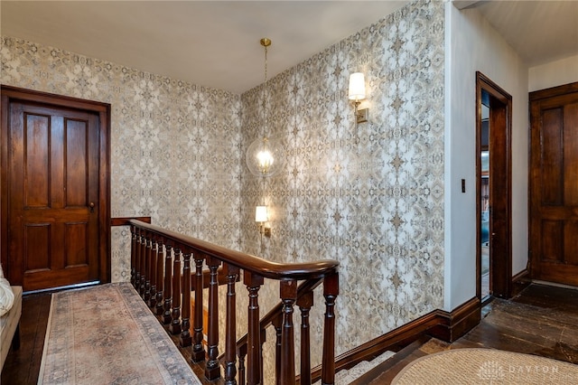 entryway featuring dark hardwood / wood-style flooring and an inviting chandelier