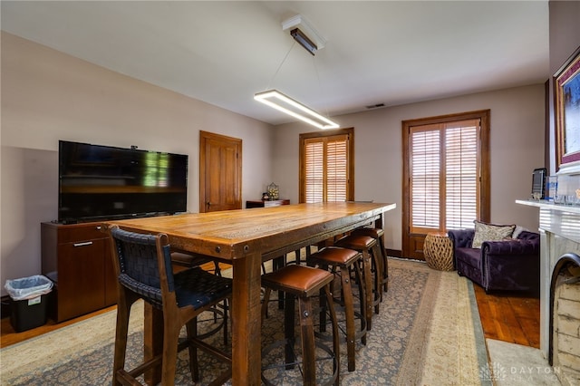 dining room with hardwood / wood-style flooring