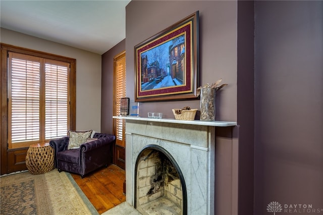 living area with hardwood / wood-style flooring