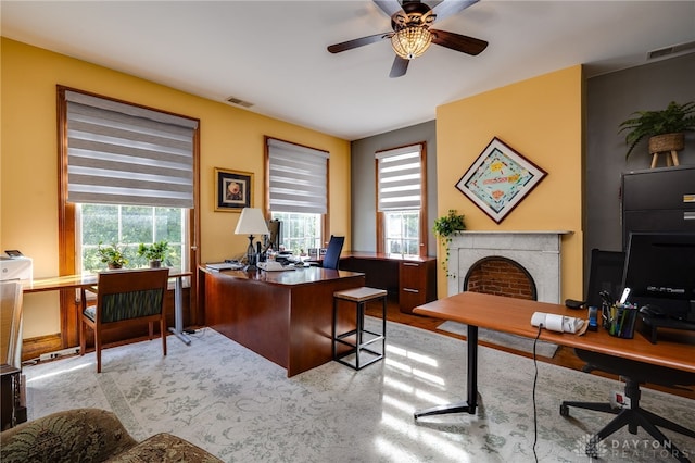 office space featuring ceiling fan and light hardwood / wood-style flooring