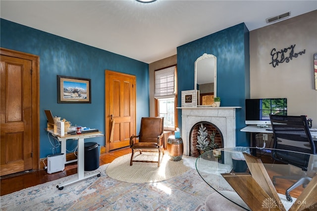 sitting room with hardwood / wood-style flooring