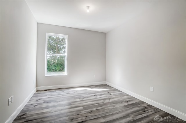 empty room featuring hardwood / wood-style flooring