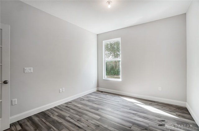 empty room featuring wood-type flooring