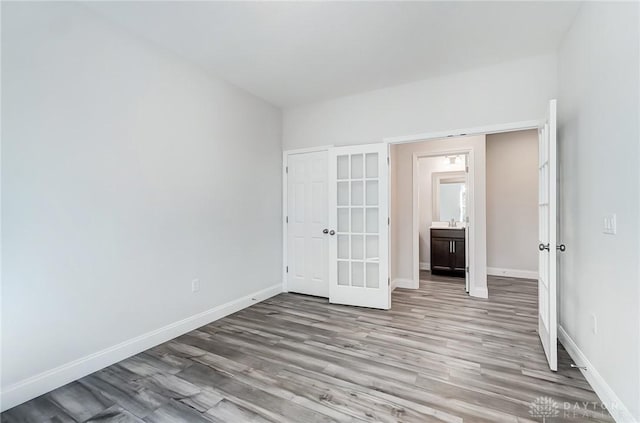 536 Hines Cir, Washington Twp, OH 45458 - spare room featuring french doors, wood finished floors, and baseboards