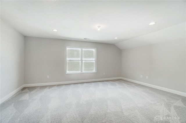 536 Hines Cir, Washington Twp, OH 45458 - spare room featuring light colored carpet, baseboards, vaulted ceiling, and recessed lighting
