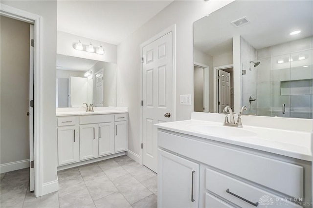 536 Hines Cir, Washington Twp, OH 45458 - full bathroom with a shower stall, two vanities, baseboards, and tile patterned flooring