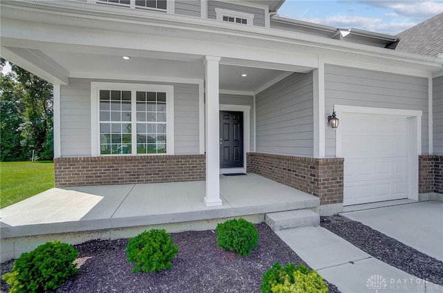 view of exterior entry with a garage