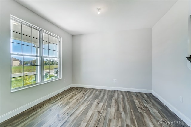 unfurnished room featuring hardwood / wood-style floors