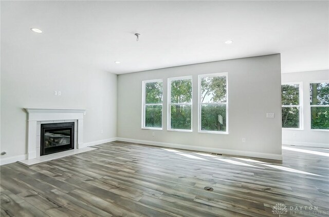 536 Hines Cir, Washington Twp, OH 45458 - unfurnished living room with wood finished floors, baseboards, a high end fireplace, and recessed lighting