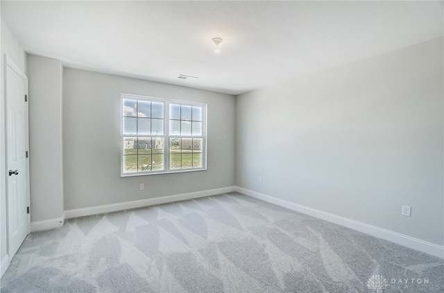 empty room with light colored carpet