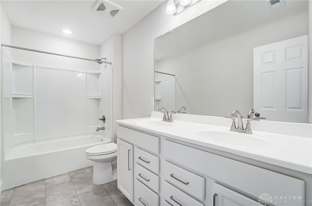 full bathroom with tile patterned flooring, bathing tub / shower combination, toilet, and vanity