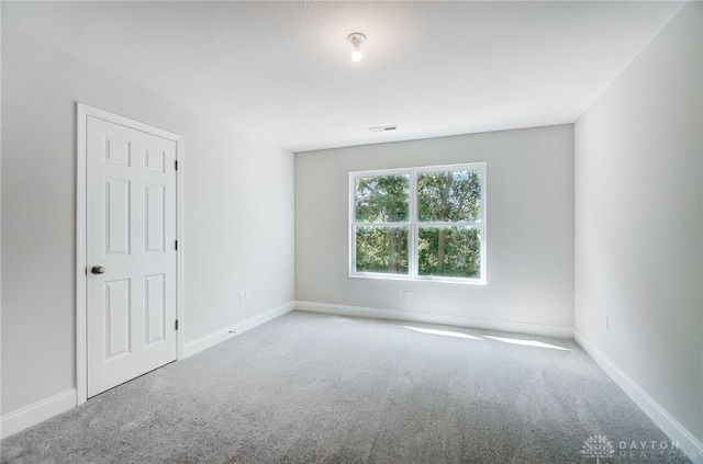 empty room with carpet flooring