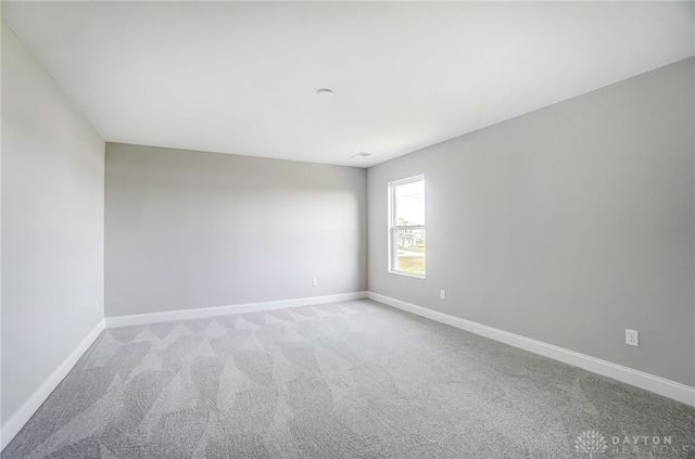 empty room featuring carpet floors