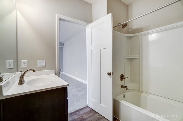 bathroom featuring bathing tub / shower combination, wood-type flooring, and vanity