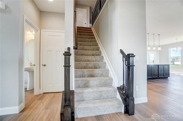 stairs with wood-type flooring