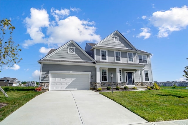 craftsman inspired home with a garage and a front yard