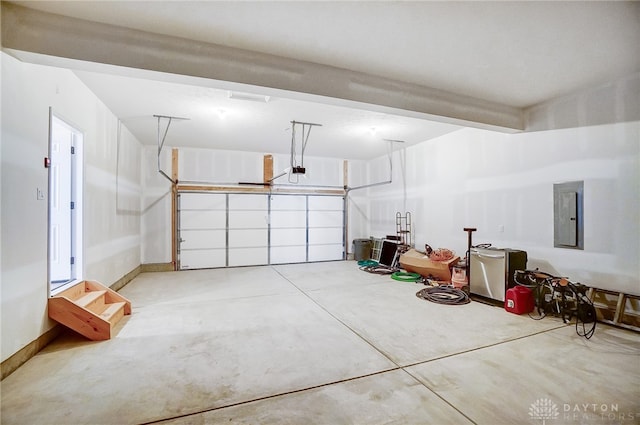 garage featuring a garage door opener and electric panel