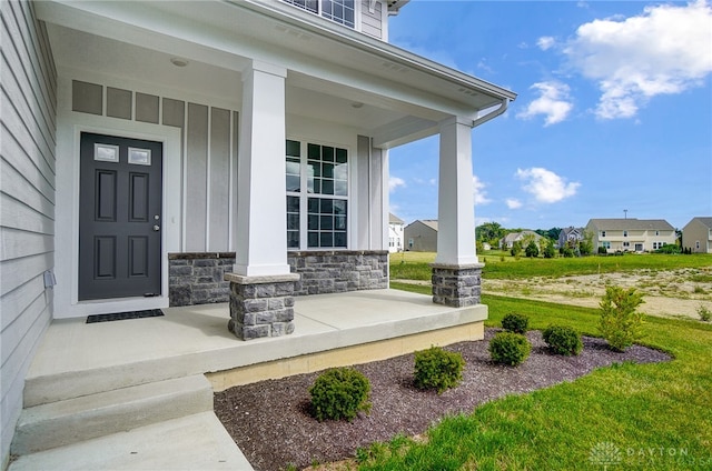 entrance to property featuring covered porch