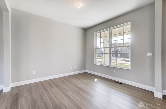 empty room featuring hardwood / wood-style floors