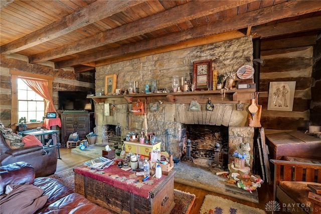 living room with beam ceiling, a fireplace, wooden ceiling, and hardwood / wood-style flooring