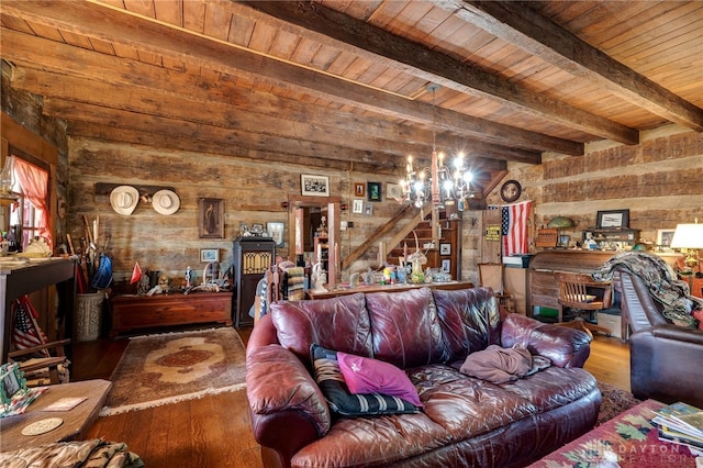 living room with hardwood / wood-style flooring, beam ceiling, a chandelier, and wooden ceiling