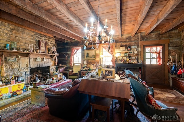 dining room with wood ceiling, a fireplace, and a wealth of natural light