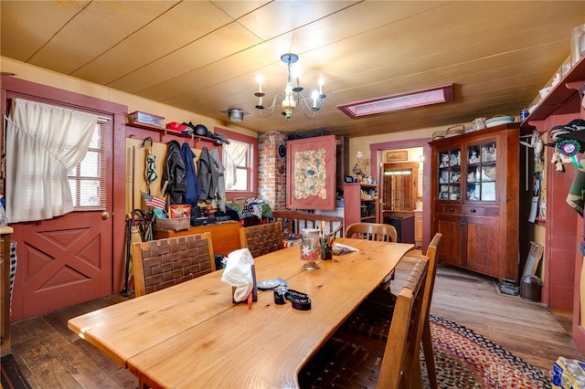 dining area featuring wooden ceiling, dark hardwood / wood-style floors, and a notable chandelier