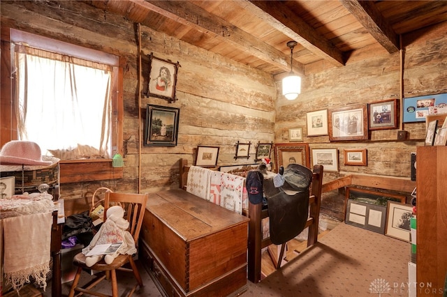 interior space featuring wood ceiling and beamed ceiling