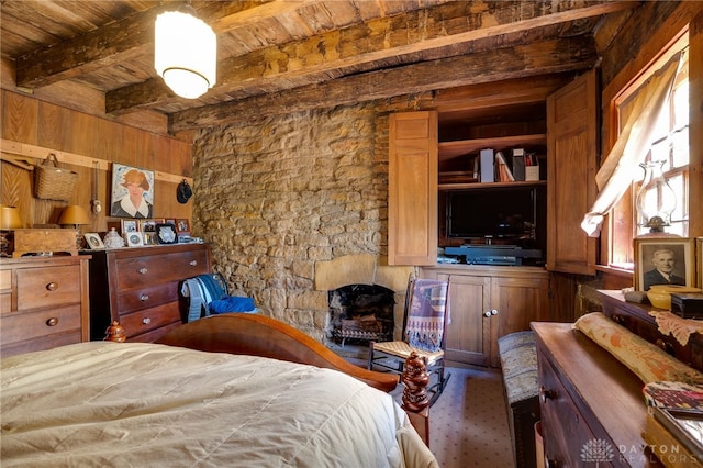 bedroom featuring wood ceiling and beam ceiling