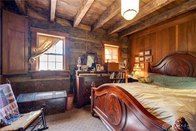 bedroom with beamed ceiling, wooden walls, and wood ceiling