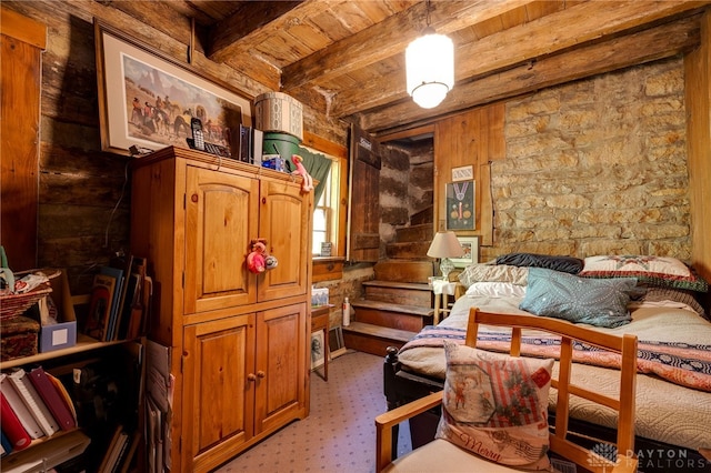 bedroom with wood ceiling and beamed ceiling