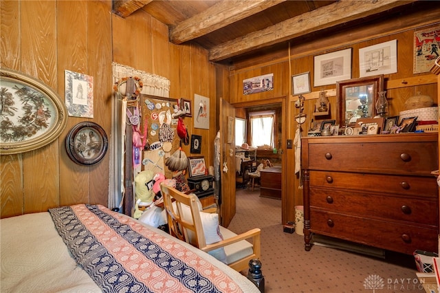 carpeted bedroom featuring beamed ceiling, wooden walls, and wooden ceiling